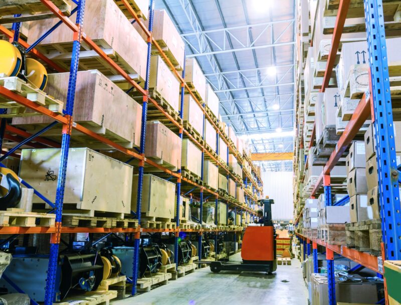 Modern warehouse with forklifts